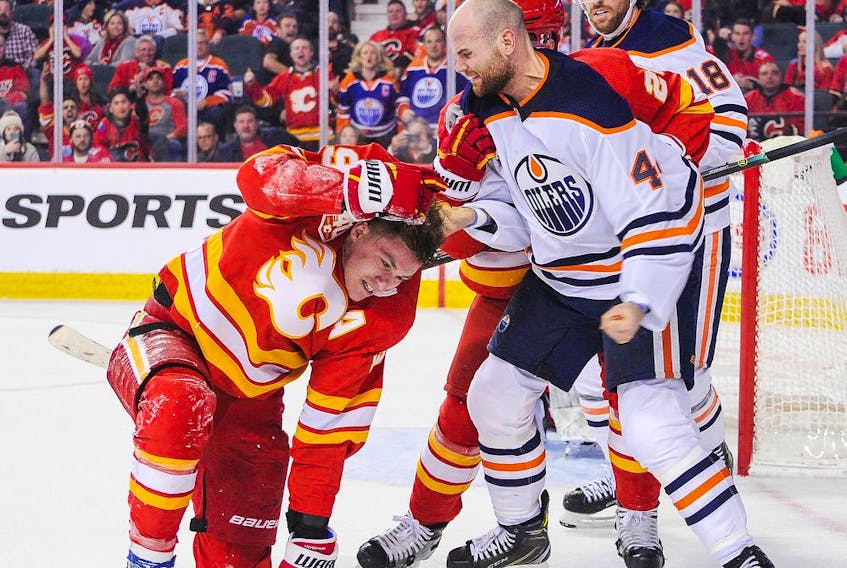 Zack Kassian #44 of the Edmonton Oilers fights Matthew Tkachuk #19 of the Calgary Flames during an NHL game at Scotiabank Saddledome on Jan. 11, 2020 in Calgary.