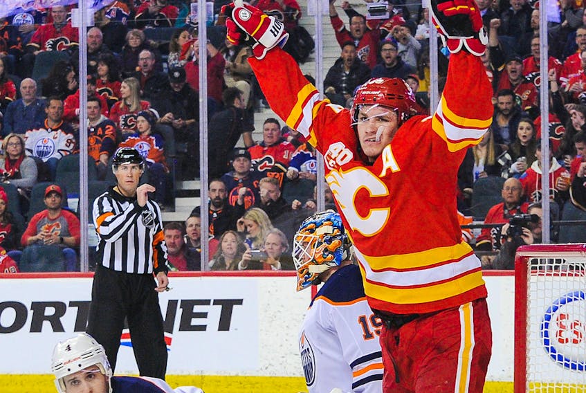  Matthew Tkachuk (19) of the Calgary Flames celebrates after teammate Elias Lindholm scored against Mikko Koskinen of the Edmonton Oilers at Scotiabank Saddledome on Jan. 11, 2020 in Calgary, Alberta, Canada.