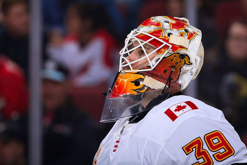 GLENDALE, ARIZONA - DECEMBER 10: Goaltender Cam Talbot #39 of the Calgary Flames looks down ice during the first period of the NHL game against the Arizona Coyotes at Gila River Arena on December 10, 2019 in Glendale, Arizona. The Flames defeated the Coyotes 5-2.  (Photo by Christian Petersen/Getty Images)