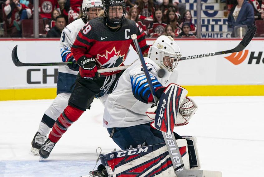  Canada’s Marie-Philip Poulin looks on as a shot by teammate goes over the shoulder of U.S. goalie Aerin Frankel for a goal during Game 4 of the 2020 Rivalry Series at Rogers Arena on Feb. 5, 2020, in Vancouver.