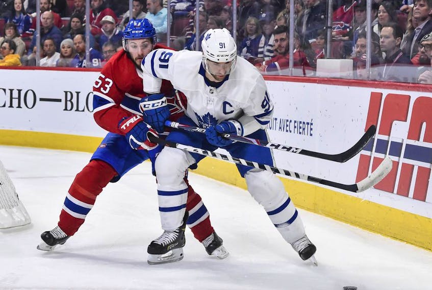 Canadiens defenceman Victor Mete checks Toronto Maple Leafs captain John Tavares during game at the Bell Centre on Feb. 8, 2020.