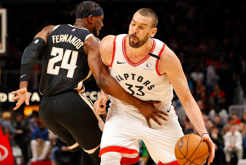 Marc Gasol of the Raptors draws a foul from Bruno Fernando. Kevin C. Cox/Getty Images)