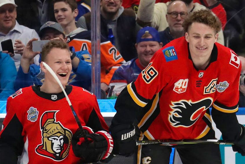 The Ottawa Senators' Brady Tkachuk chats with brother Matthew, of the Calgary Flames, during the 2020 NHL All-Star Skills Competition at Enterprise Center on Jan. 24, 2020, in St Louis.