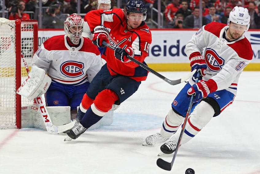 Canadiens' Tomas Tatar skates past Capitals' Nicklas Backstrom in front of goalie Carey Price Thursday night in Washington. 
