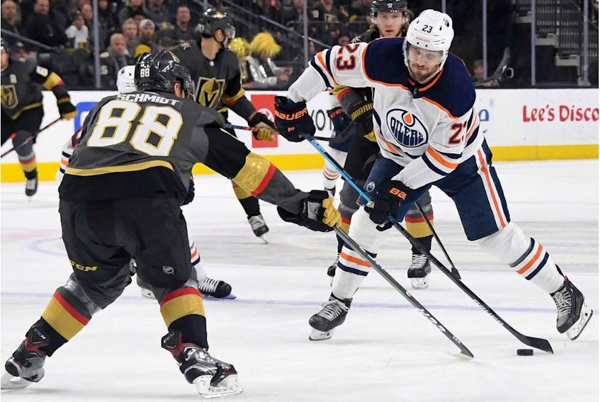 Riley Sheahan #23 of the Edmonton Oilers shoots against Nate Schmidt #88 of the Vegas Golden Knights in the first period of their game at T-Mobile Arena on February 26, 2020 in Las Vegas, Nevada. The Golden Knights defeated the Oilers 3-0.