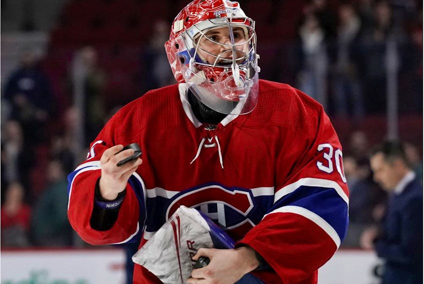  Canadiens rookie goaltender Cayden Primeau throws pucks to the crowd after being named the game’s first star Wednesday night.