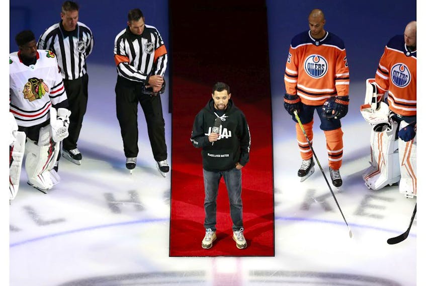 EDMONTON, ALBERTA - AUGUST 01: Mathew Dumba of the Minnesota Wild speaks before the game between the Edmonton Oilers and the Chicago Blackhawks in Game One of the Eastern Conference Qualification Round prior to the 2020 NHL Stanley Cup Playoffs  at Rogers Place on August 01, 2020 in Edmonton, Alberta. Dumba spoke about the NHL's commitment to ending racism.