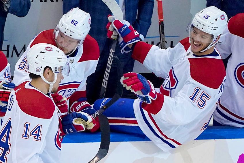 Nick Suzuki #14 of the Montreal Canadiens is congratulated by teammate Jesperi Kotkaniemi #15 after Suzuki scored a goal in the second period against the Pittsburgh Penguins during Game One of the Eastern Conference Qualification Round prior to the 2020 NHL Stanley Cup Playoffs at Scotiabank Arena on Aug. 1, 2020 in Toronto.
