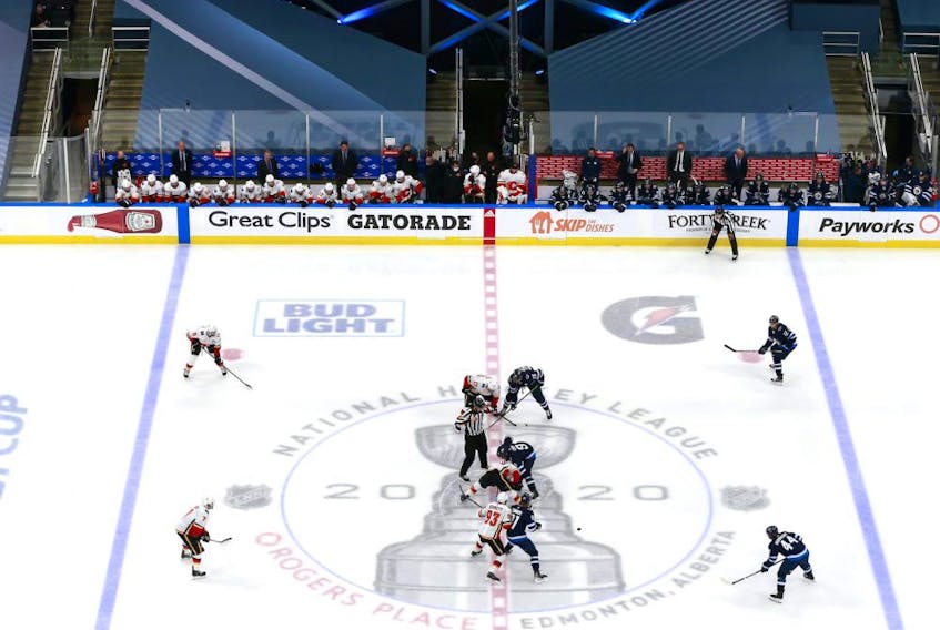  The Calgary Flames and the Winnipeg Jets face off to start the third period in Game 3 of the Western Conference Qualification Round at Rogers Place on August 04, 2020.