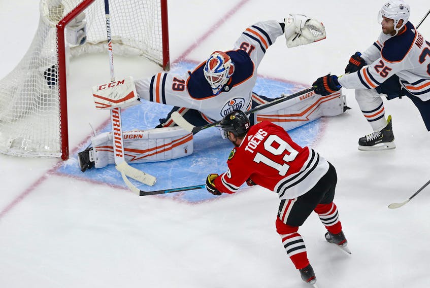 Jonathan Toews #19 of the Chicago Blackhawks misses a shot against Mikko Koskinen #19 of the Edmonton Oilers during the third period in Game 3 of the Western Conference Qualification Round at Rogers Place on August 05, 2020.