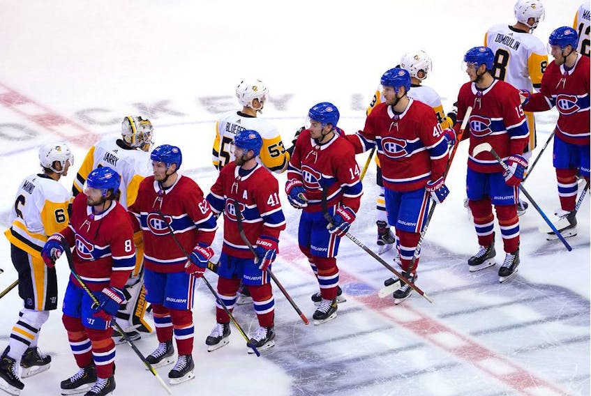 The Canadiens and the Pittsburgh Penguins pump elbows after the series finale in Game Four of the Eastern Conference Qualification Round prior to the 2020 NHL Stanley Cup Playoffs at Scotiabank Arena on Friday, Aug. 7, 2020, in Toronto.