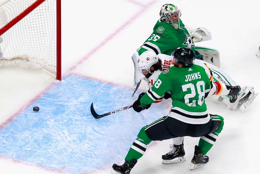 Dillon Dube (No. 29) of the Calgary Flames scores his second goal of the game at 18:02 of the first period against goalie Anton Khudobin of the Dallas Stars in Game 1 of Western Conference first-round action during the 2020 NHL Stanley Cup Playoffs at Rogers Place on August 11, 2020 in Edmonton.