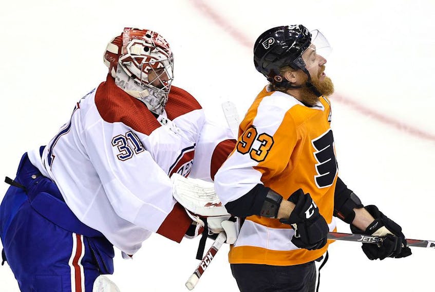 Canadiens goalie Carey Price shoves Philadelphia Flyers forward Jakub Voracek during Game 1 of their playoff series Wednesday night at Toronto’s Scotiabank Arena.