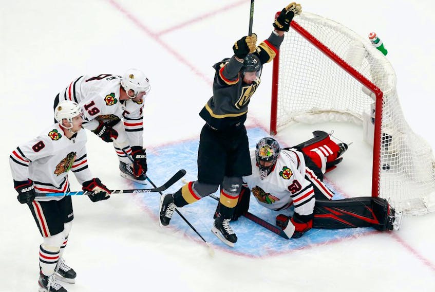 Reilly Smith #19 of the Vegas Golden Knights scores the game-winning goal at 7:13 of overtime against the Chicago Blackhawks to win the game 4-3 in Game 2 of the Western Conference First Round during the 2020 NHL Stanley Cup Playoffs at Rogers Place on August 13, 2020.