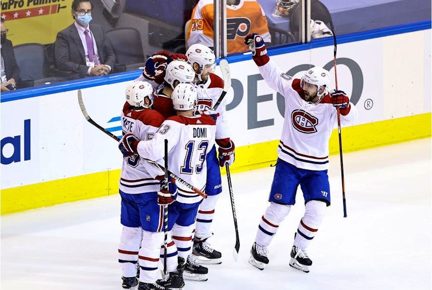 Jesperi Kotkaniemi #15 of the Montreal Canadiens celebrates with his teammates after scoring a goal on Brian Elliott of the Philadelphia Flyers during the third period in Game Two of the Eastern Conference First Round in the 2020 NHL Stanley Cup Playoffs at Scotiabank Arena on August 14, 2020 in Toronto.