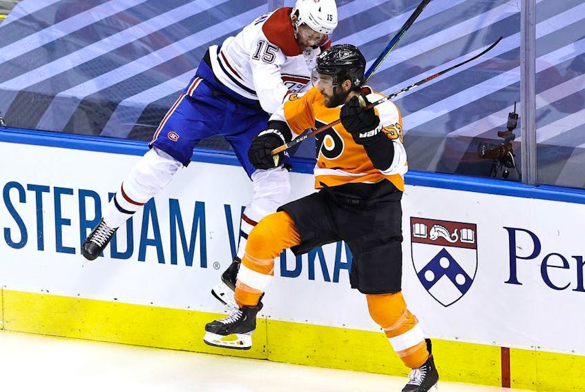 Canadiens' Jesperi Kotkaniemi collides with Flyers defeceman Shayne Gostisbehere during Game 2 Friday afternoon in Toronto. Kotkaniemi had two goals in the game.
