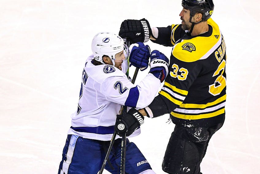 Luke Schenn of the Tampa Bay Lightning scuffles with Zdeno Chara of the Boston Bruins in Game 3 of the Eastern Conference second round of the 2020 NHL Stanley Cup Playoffs at Scotiabank Arena on August 26, 2020 in Toronto.