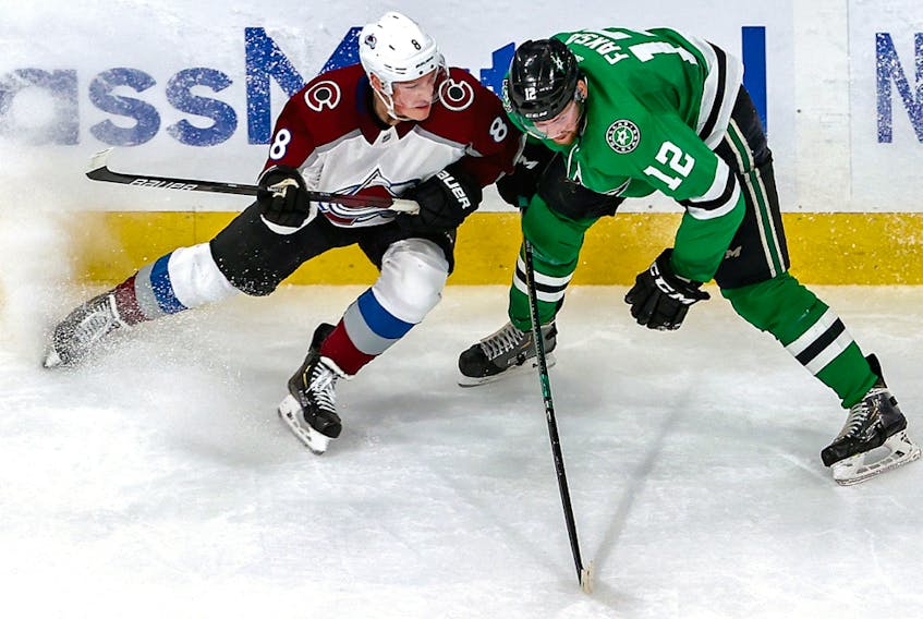 Cale Makar of the Colorado Avalanche checks Radek Faksa of the Dallas Stars in Game 3 of the Western Conference second round of the 2020 NHL Stanley Cup Playoffs at Rogers Place on Wednesday, August 26, 2020.
