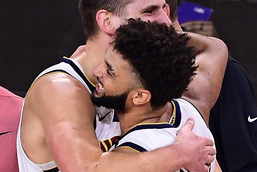 Nuggets teammates Jamal Murray (right) and Nikola Jokic celebrate after beating the Clippers to advance to face the Lakers in the Western Conference final. 