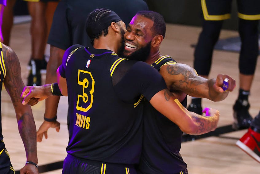 Lakers’ LeBron James (right) celebrates with Anthony Davis after the big centre sank a three-point basket to beat the Nuggets in Game 2 of their series on Sunday. 