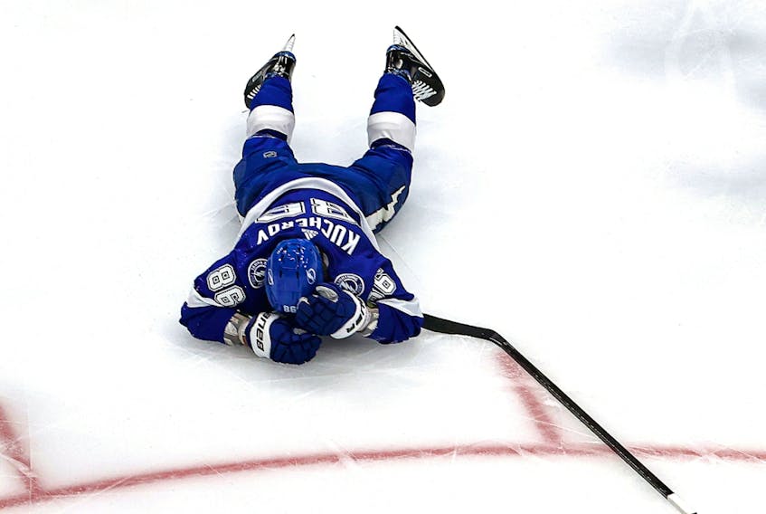 Nikita Kucherov of the Tampa Bay Lightning reacts after getting hit against the Dallas Stars in Game 2 of the 2020 NHL Stanley Cup Final at Rogers Place on Sept. 21, 2020.