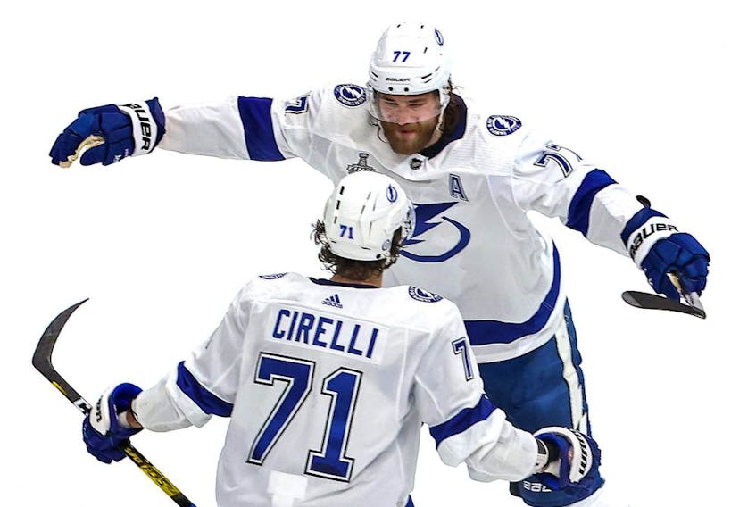ictor Hedman (77) of the Tampa Bay Lightning is congratulated by Anthony Cirelli (71) after scoring a goal against the Dallas Stars during the second period in Game 3 of the 2020 NHL Stanley Cup Final at Rogers Place on September 23, 2020. Canada.
