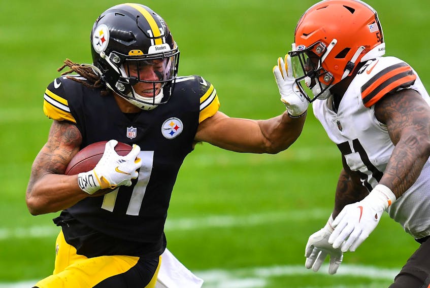 Canadian Chase Claypool of the Pittsburgh Steelers stiff arms Mack Wilson of the Cleveland Browns during their NFL game at Heinz Field on Sunday. 
