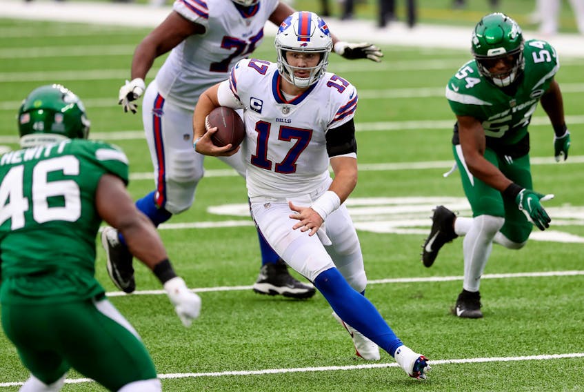 Quarterback Josh Allen #17 of the Buffalo Bills runs with the ball against the New York Jets in the fourth quarter of the game at MetLife Stadium on October 25, 2020 in East Rutherford, New Jersey. 