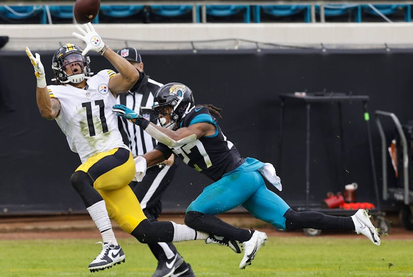 Chase Claypool  of the Pittsburgh Steelers hauls in a touchdown catch against Jaguars' Chris Claybrooks defends during the first half at TIAA Bank Field on November 22, 2020 in Jacksonville.