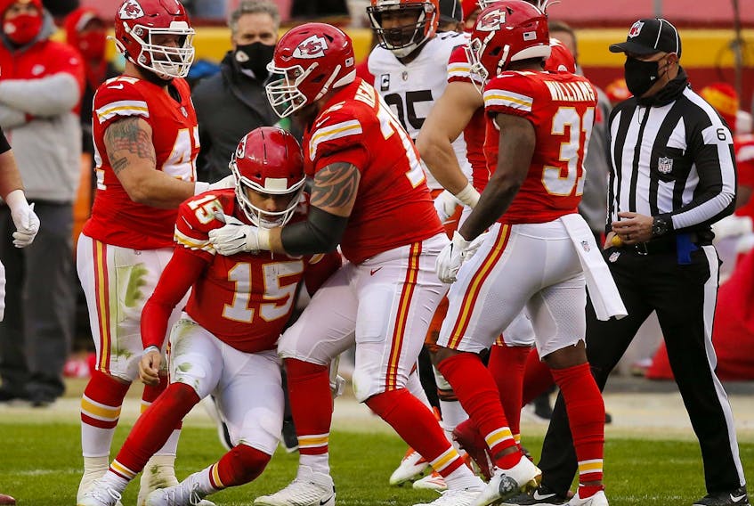 Chiefs quarterback Patrick Mahomes is assisted to his feet by offensive tackle Mike Remmers after a sack. Remmers will start at left tackle in the Super Bowl.  