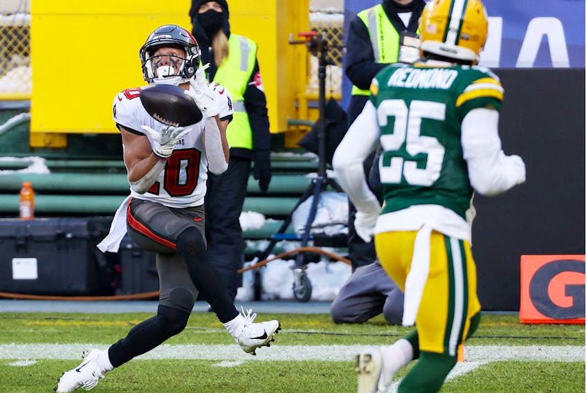 Scott Miller of the Tampa Bay Buccaneers pulls in a touchdown reception in the second quarter against the Green Bay Packers during the NFC Championship game at Lambeau Field on January 24, 2021 in Green Bay, Wisconsin.