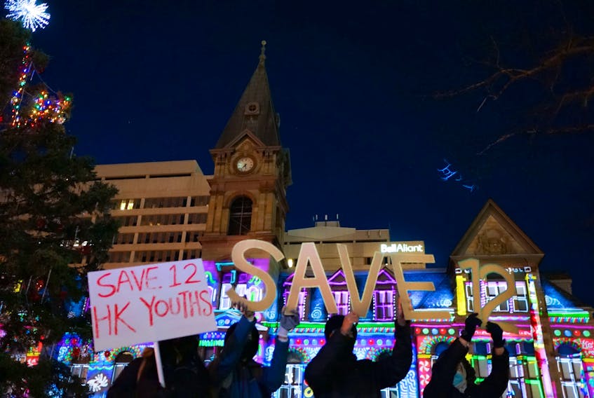 Halifax-Hong Kong Link activists draw attention to the cause of freedom at Grand Parade in Halifax in December 2020.
