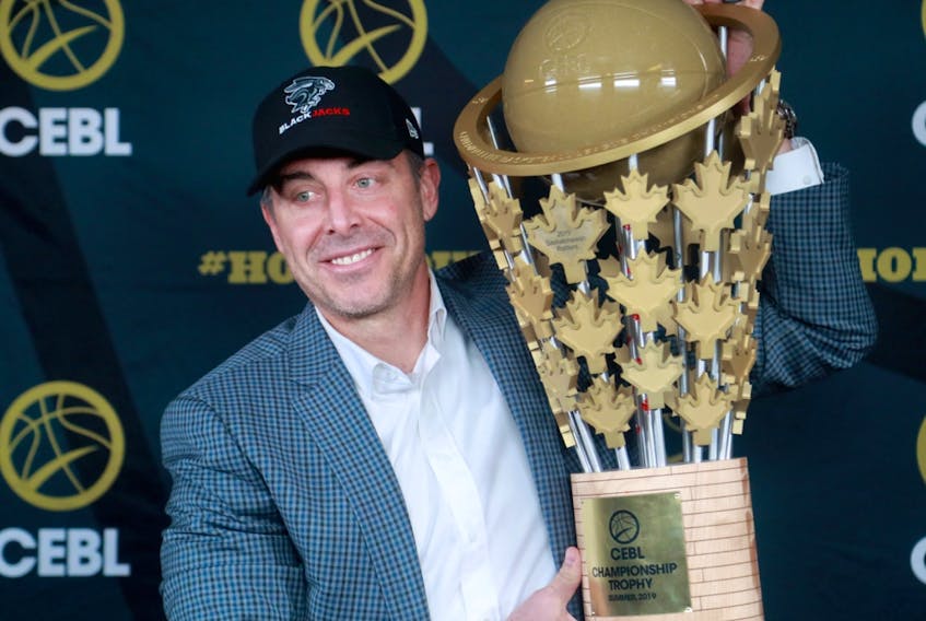 Mike Morreale, commissioner and CEO of the Canadian Elite Basketball League, holds up the CEBL championship trophy after announcing the new Ottawa BlackJacks expansion in this file photo from Nov. 20, 2019.