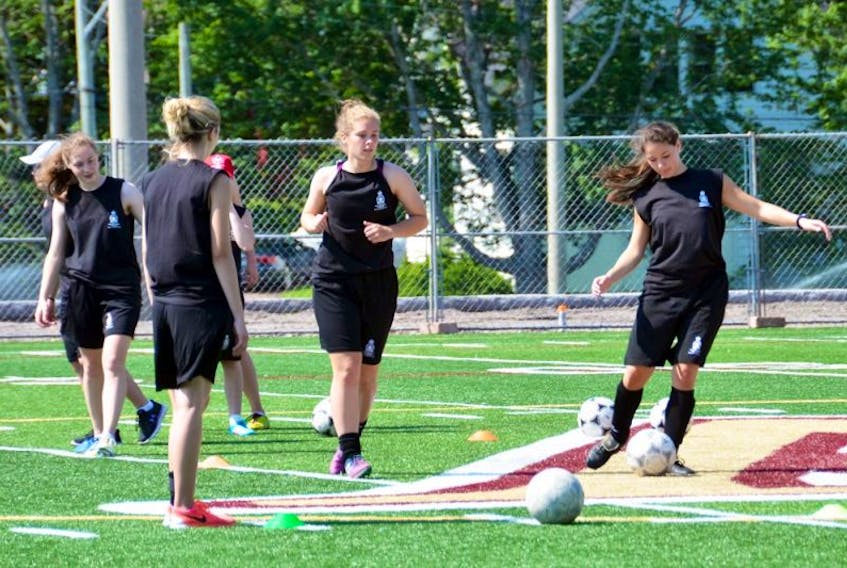 Participants in the 57th annual New Brunswick Legion Youth Leadership Camp take part in soccer drills on Mount Allison University’s Alumni Field Tuesday morning. KATIE TOWER – SACKVILLE TRIBUNE-POST