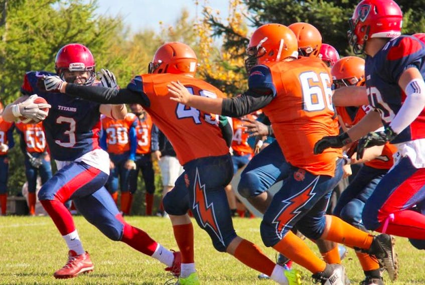 Aidan O’Neal, shown above in the Oct. 15 game against the l’Odyssee Olympiens, continued to dominate in Saturday’s game against Riverview, notching three touchdowns and racking up countless yards throughout the afternoon. PAMELA SCHNEIDER PHOTO