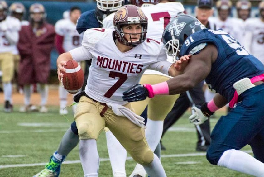 Although this may have been his rookie year, Mountie quarterback Jakob Loucks won the respect of fans, teammates and coaches. PAUL D. LYNCH PHOTO – PAULDLYNCH.COM