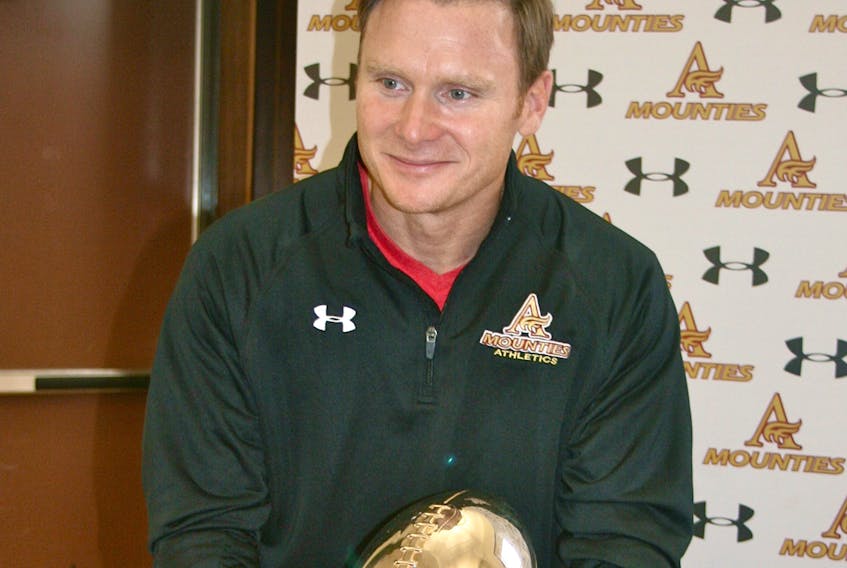 Eric Lapointe, shown during a 2013 ceremony on the Mount Allison campus, is considered the greatest football player to ever don the Garnet and Gold.