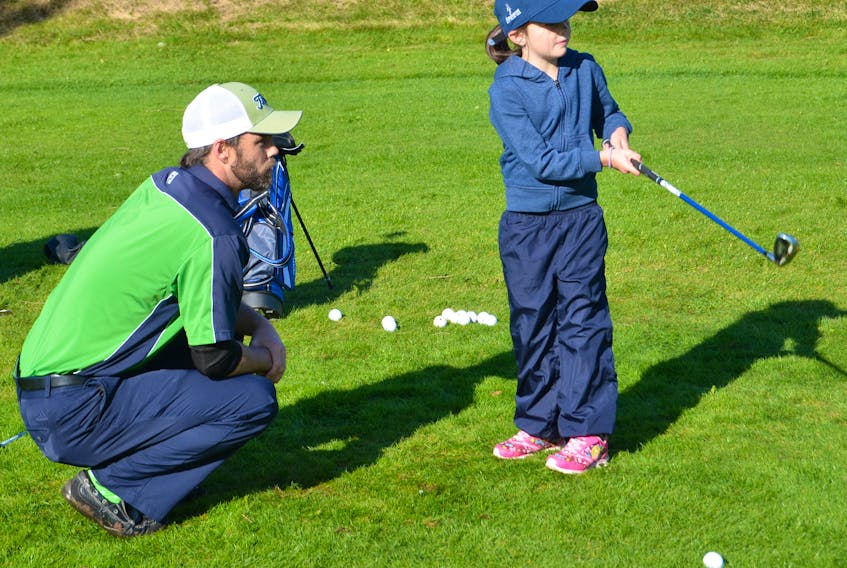 Travis Colwell, who has seven Sackville Golf and Country Club championships to his name, spends some time on the local course recently with his daughter Averie.