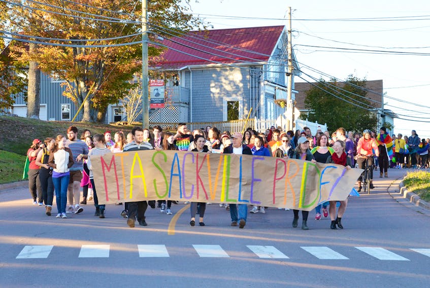 Members of the Sackville and Mount Allison communities march down Main Street towards town hall for last year’s raising of the Pride Flag. Over 220 participants took part in last year’s celebration.