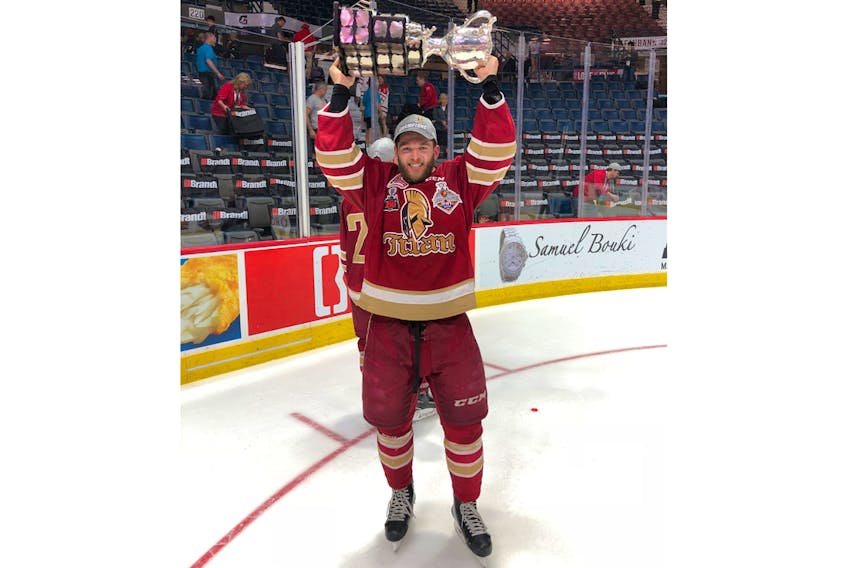 Sackville’s Ethan Crossman helped his team earn a Memorial Cup win earlier this year. Crossman, shown here hoisting the trophy after their win against the Regina Pats, is a member of the Acadie-Bathurst Titan in the Quebec Major Junior Hockey League.