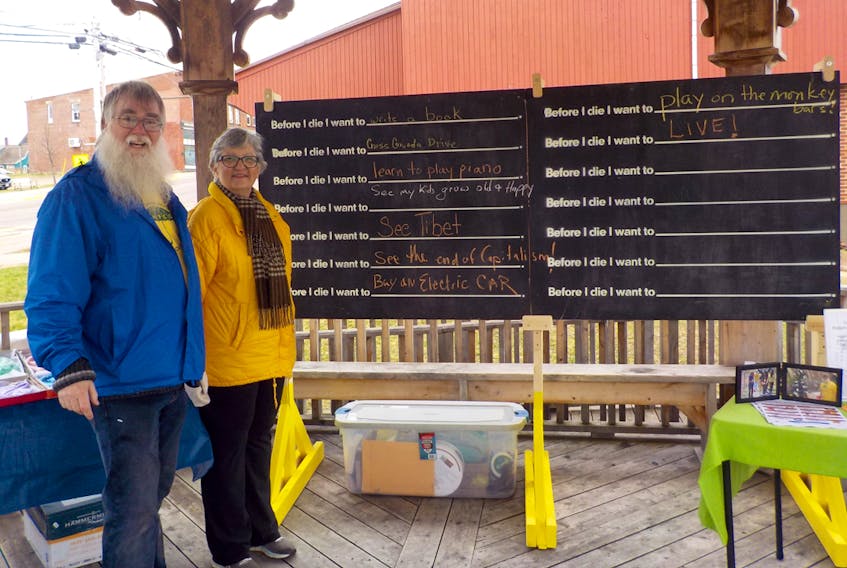 Pictured with the Before I Die wall, which was set up at the Sackville Farmers Market on May 4, are Stephen Claxton-Oldfield, chair of the Tantramar Hospice Palliative Care Organization, along with one of the organization’s members, Heather Longpre.