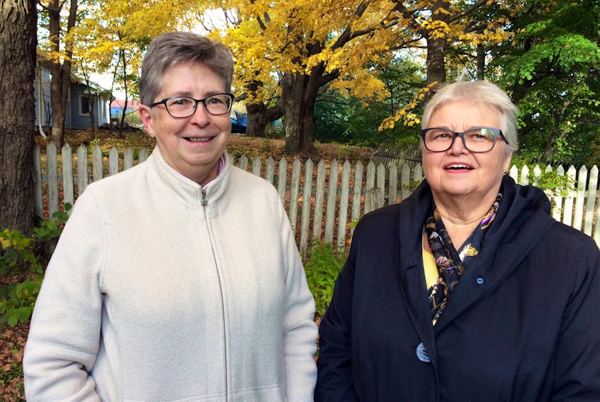 Heather Patterson, left, and Holly Chapman volunteer with Autumn House, an organization that strives to eliminate violence in intimate-partner relationships.