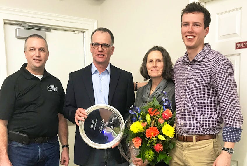 Timber River Eco Farms was honoured as Farm of the Year by the Chignecto Soil & Crop Association at an awards ceremony held in late January in Sackville. From left, Kent Curtis, representative for Cavendish Agri-services, sponsor of the award, and Pirmin, Katrine and Jonathan Kummer, after being presented with flowers and a commemorative plaque.