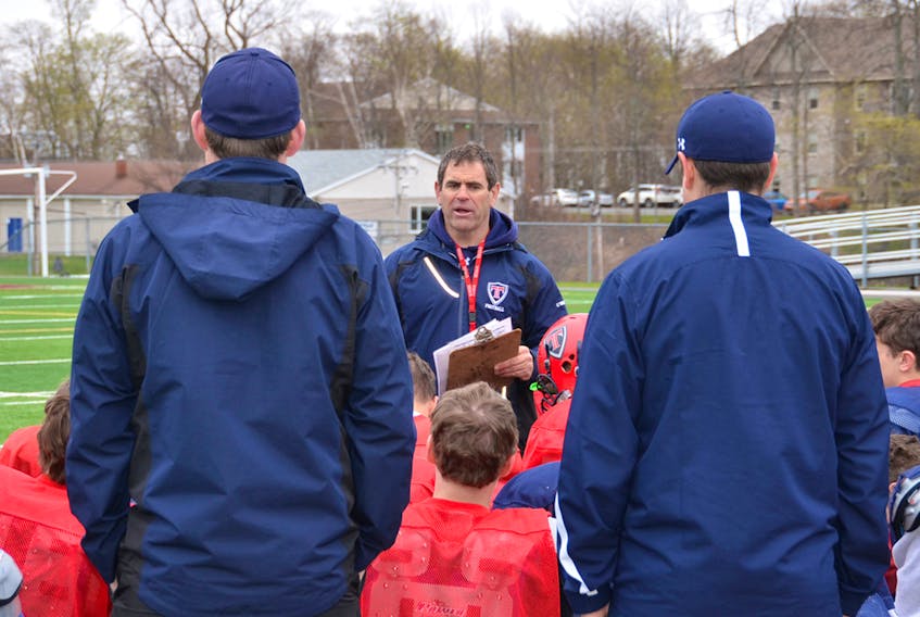 Sackville Titans head coach Scott O’Neal, shown speaking to players at last year’s spring training camp, demands a lot from his players to ensure they are able to play the game safely.