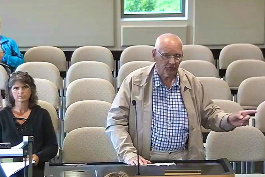In this still photo taken from a video of this month’s Sackville town council meeting, local resident Merlin Estabrooks asks why a town manager interrupted a private conversation he was having with a contractor in the lobby of town hall the previous week. He said he was told he wasn’t able to discuss the project privately with the contractor unless he was willing to pay for his time.