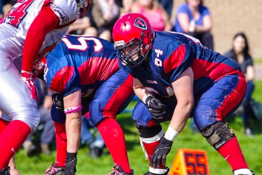 Dylan Estabrooks (right), shown during his time with the Tantramar Regional High School football Titans, recently played for the Canadian U18 team at the North American championship in Orlando, Florida.