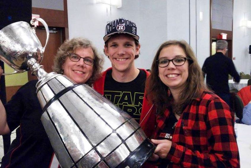Above, Wray Perkin is shown with his mother Dodie and sister Joanna following the Ottawa Redblack’s 2016 Grey Cup win.