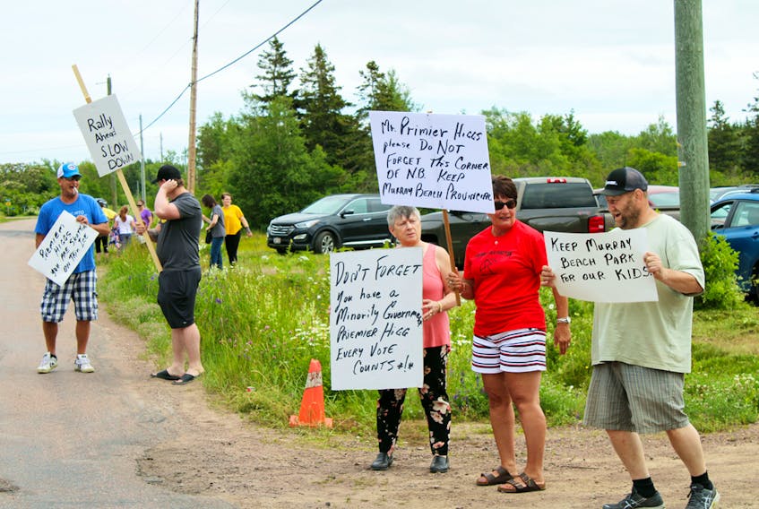 A large group of supporters turned out at the Murray Beach Action rally on Saturday in Murray Corner. A number of political figures spoke to those gathered, while cars passing by honked their horns in support and many of those who attended carried signs protesting the NB government's scheduled plan to transfer operation of Murray Beach Provincial Park to the private sector in 2020.
