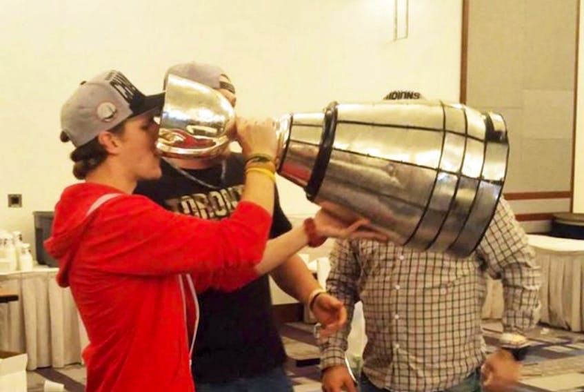 The Grey Cup will be in Sackville this Sunday. Above, Wray Perkin, a Sackville native and assistant equipment manager for the Ottawa Redblacks, drinks from the cup following his team’s 2016 win.