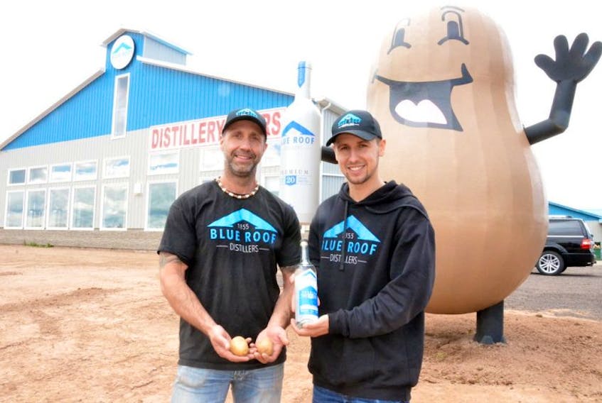 Left to right, father and son Richard and Devon Strang stand outside their new distillery in Malden, N.B. Producing and bottling vodka is the latest venture at their family's potato farm.